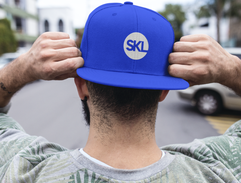 SKL Group brand mark on cap