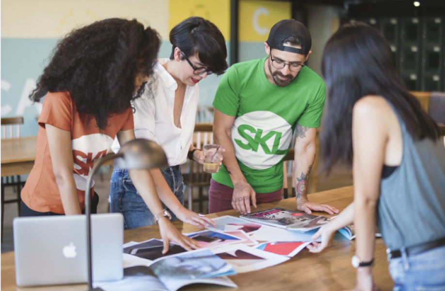 SKL Group team collaborating in a modern studio